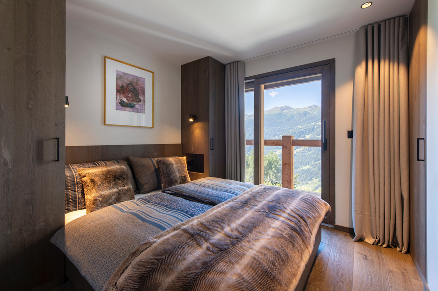 appartement-le-bry-c02-verbier-chambre-cosy-11.jpg