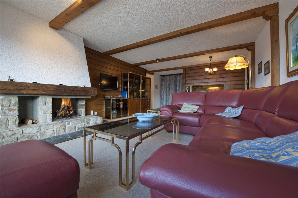 appartement-flaminia-326-verbier-coin-cheminee-salon-03.jpg